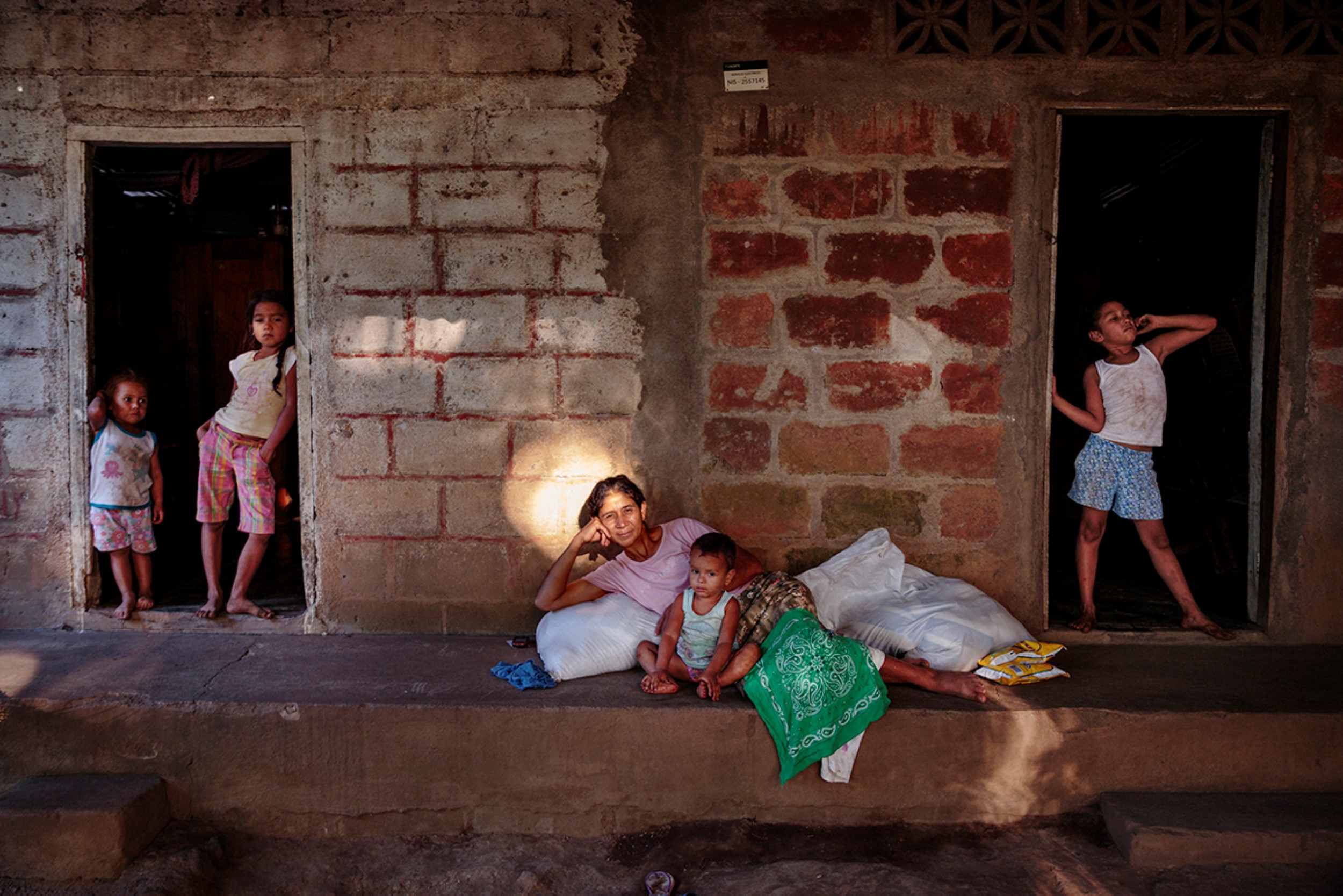 © Ed Kashi/VII   VII, Ed Kashi, Color Photograph, La Isla Foundation, LIF, La Isla, Solidaridad, Sugarcane, Sugar Cane, Cane Workers, Labor, Workers, Kidney Disease, CKDu, CKDnT, Chronic Kidney Disease, Epidemic, Illness, Health, Healthcare, Cane Field, Sugar Cane Workers, Cane Cutters, Farm, Manual Labor, Agriculture, Food, Sugar, 2015, Sick, Ill Dying, Death, Pain, Injustice, Social, Human Rights, Health Issue, Sickly, Island of Widows, Central America, Outdoors, Outdoor, Exterior, Outside, Portrait, Juana Chevez, Food Ration, Monthly Ration, Ration, Provisions, Family, Children, Woman, Women, Female, Girl, Child, Youth, Young, Baby, Babies, Boy, Employee, Ill, Halo, Sun Beam, Sun Light, Speckled Light, Widow, Mother, Daughters, Son, Nicaragua