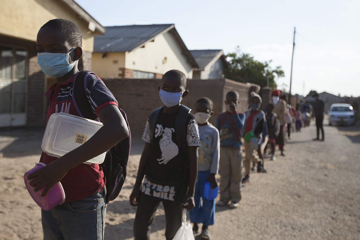 Picture C-Children queue for porridge at Muzoroki's open air humanitarian kitchen.jpg