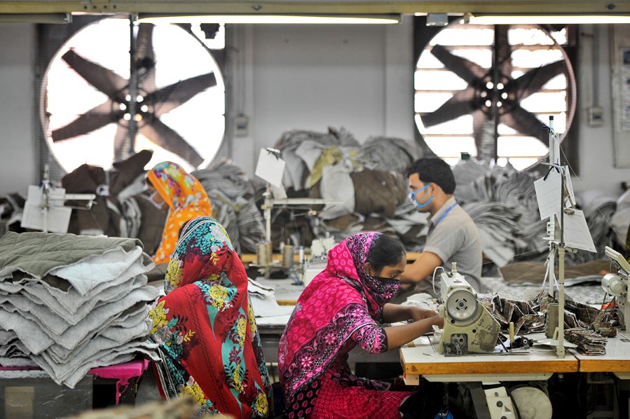 Copyright (c) 2014 Shutterstock. No use without permission.  A, 14, MAY, WORKERS, BANGLADESH, DHAKA, 23090538, AT, 2014, Not-Personality, MAKING, WORK, PEOPLE, CLOTHES, GARMENT, FACTORY